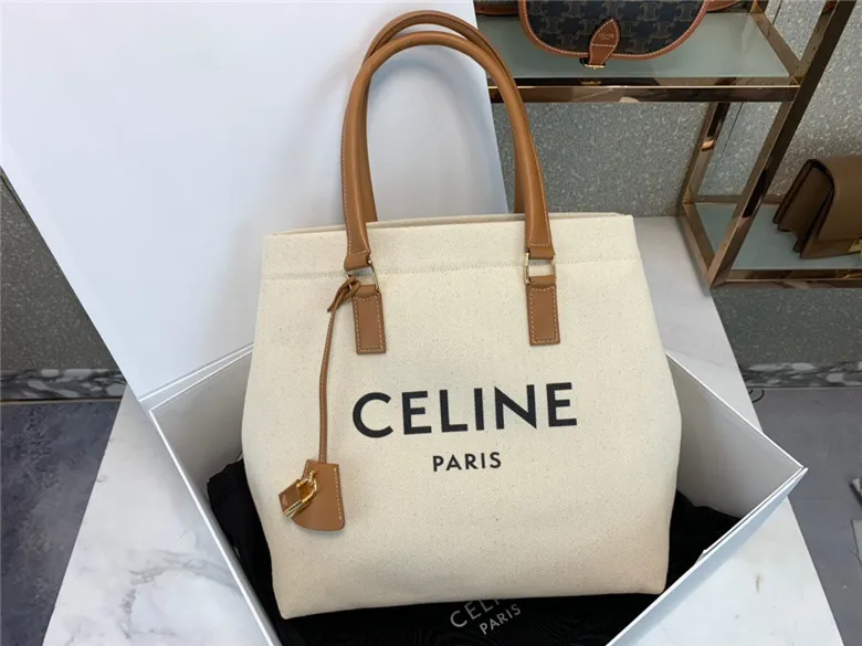 CELINE-HORIZONTAL-CABAS-CELINE-IN-CANVAS-WITH-CELINE-PRINT-AND-CALFSKIN-NATURAL-TAN-192162BNZ.02NT-02 CELINE HORIZONTAL CABAS CELINE IN CANVAS WITH CELINE PRINT AND CALFSKIN NATURAL TAN 192162BNZ.02NT 02