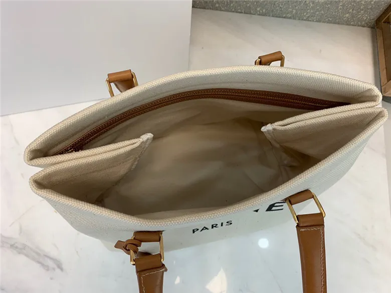 CELINE-HORIZONTAL-CABAS-CELINE-IN-CANVAS-WITH-CELINE-PRINT-AND-CALFSKIN-NATURAL-TAN-192162BNZ.02NT-05 CELINE HORIZONTAL CABAS CELINE IN CANVAS WITH CELINE PRINT AND CALFSKIN NATURAL TAN 192162BNZ.02NT 05