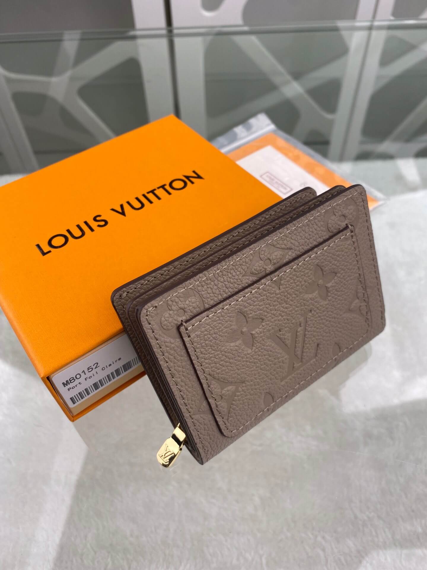 louis-vuitton-cléa-wallet-monogram-empreinte-leather-wallets-and-small-leather-goods-M80152-02 louis vuitton clea wallet monogram empreinte leather wallets and small leather goods M80152 02
