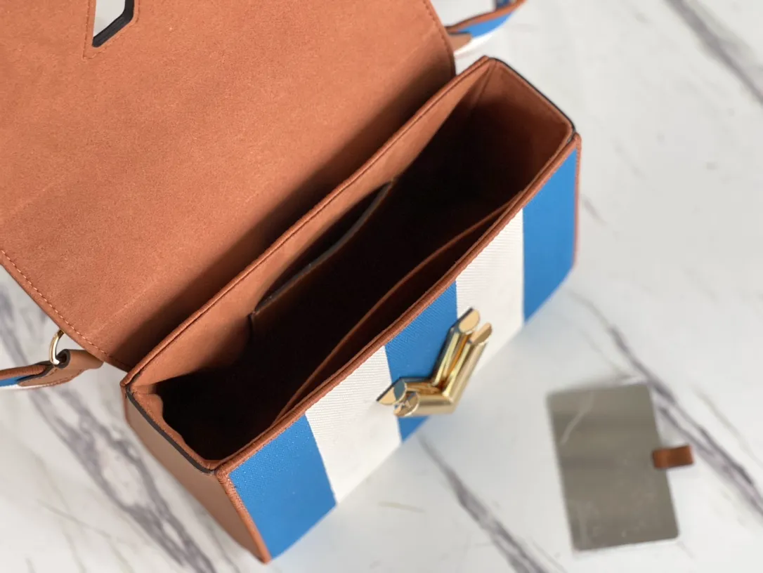 LOUIS VUITTON TWIST MM HANDBAG EMBROIDERED CANVAS AND CALF LEATHER BLUE M57659_05 LOUIS VUITTON TWIST MM HANDBAG EMBROIDERED CANVAS AND CALF LEATHER BLUE M57659 05