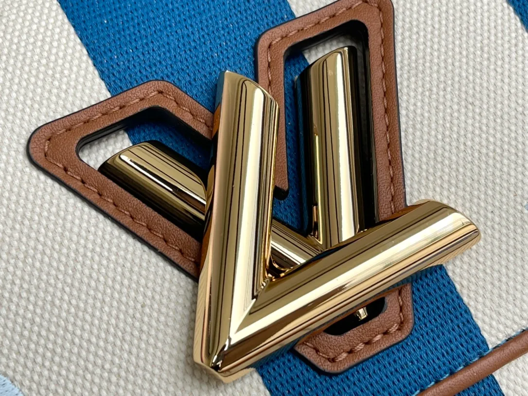 LOUIS VUITTON TWIST MM HANDBAG EMBROIDERED CANVAS AND CALF LEATHER BLUE M57659_06 LOUIS VUITTON TWIST MM HANDBAG EMBROIDERED CANVAS AND CALF LEATHER BLUE M57659 06