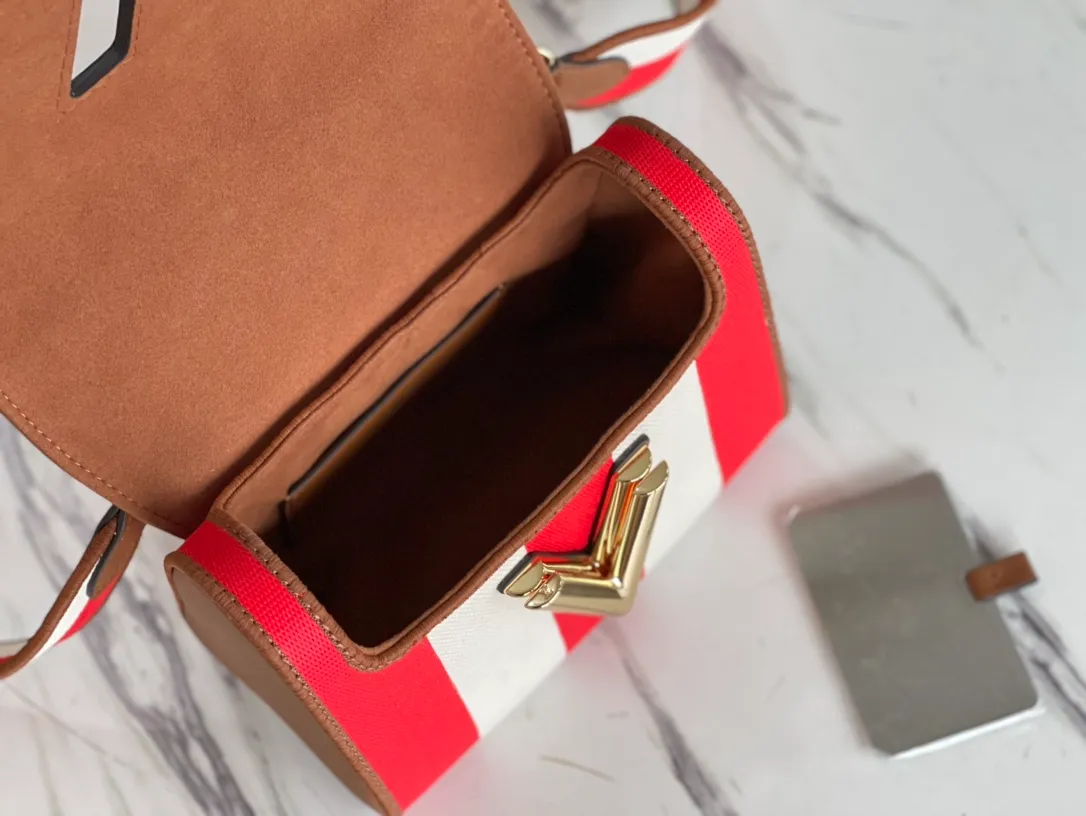 LOUIS VUITTON TWIST PM HANDBAG EMBROIDERED CANVAS AND CALF LEATHER RED M57722_05 LOUIS VUITTON TWIST PM HANDBAG EMBROIDERED CANVAS AND CALF LEATHER RED M57722 05