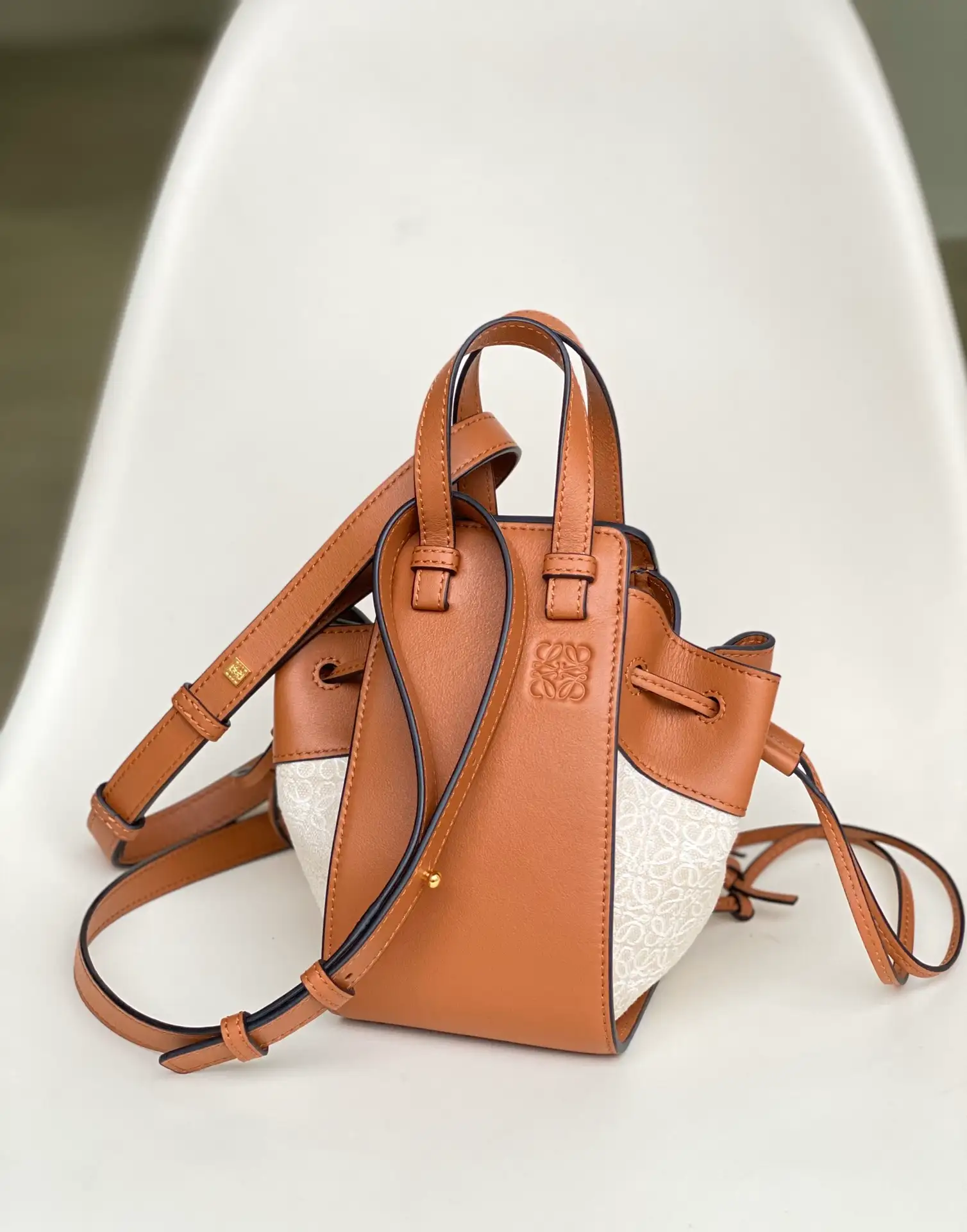 LOEWE-MINI-HAMMOCK-DRAWSTRING-BAG-ANAGRAM-JACQUARD-CALFSKIN-TAN-A538V07X11-2426_1 LOEWE MINI HAMMOCK DRAWSTRING BAG ANAGRAM JACQUARD CALFSKIN TAN A538V07X11 2426 1