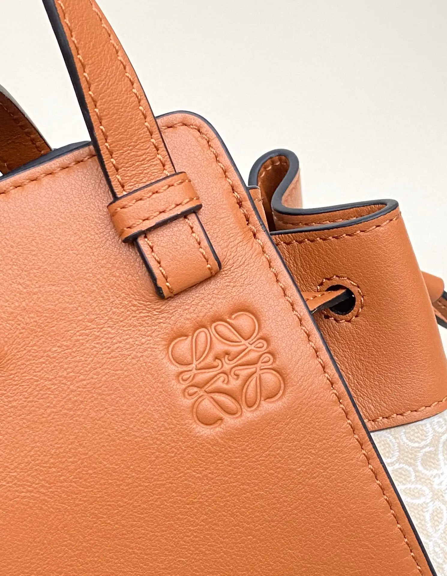 LOEWE-MINI-HAMMOCK-DRAWSTRING-BAG-ANAGRAM-JACQUARD-CALFSKIN-TAN-A538V07X11-2426_4 LOEWE MINI HAMMOCK DRAWSTRING BAG ANAGRAM JACQUARD CALFSKIN TAN A538V07X11 2426 4