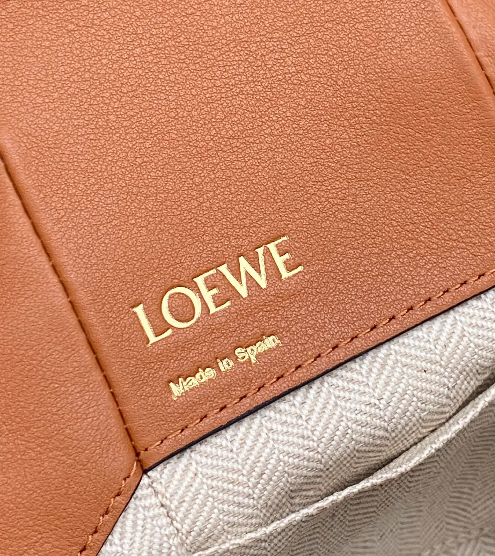 LOEWE-MINI-HAMMOCK-DRAWSTRING-BAG-ANAGRAM-JACQUARD-CALFSKIN-TAN-A538V07X11-2426_5 LOEWE MINI HAMMOCK DRAWSTRING BAG ANAGRAM JACQUARD CALFSKIN TAN A538V07X11 2426 5