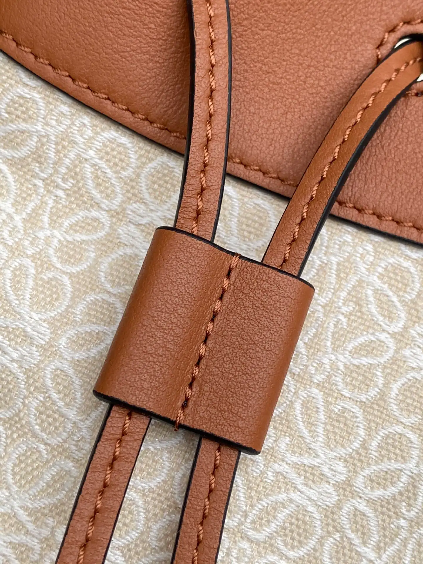 LOEWE-MINI-HAMMOCK-DRAWSTRING-BAG-ANAGRAM-JACQUARD-CALFSKIN-TAN-A538V07X11-2426_8 LOEWE MINI HAMMOCK DRAWSTRING BAG ANAGRAM JACQUARD CALFSKIN TAN A538V07X11 2426 8