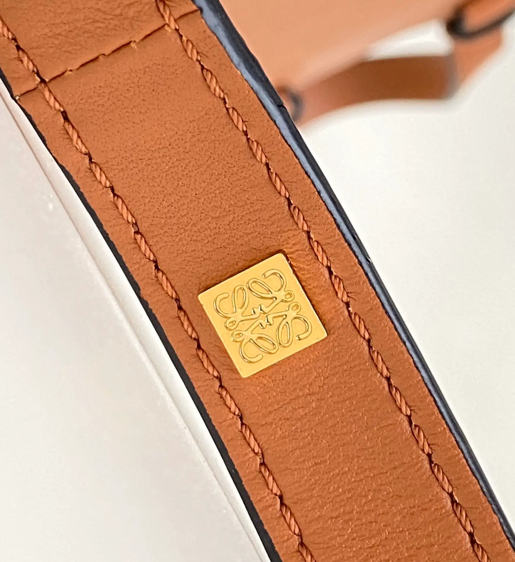 LOEWE-MINI-HAMMOCK-DRAWSTRING-BAG-ANAGRAM-JACQUARD-CALFSKIN-TAN-A538V07X11-2426_9 LOEWE MINI HAMMOCK DRAWSTRING BAG ANAGRAM JACQUARD CALFSKIN TAN A538V07X11 2426 9