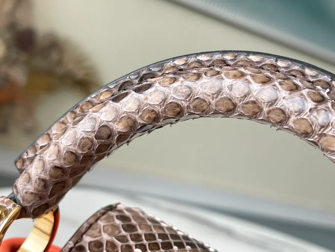 LOUIS VUITTON CAPUCINES MINI HANDBAG TAURILLON AND PYTHON LEATHER ORANGE N80007_8 LOUIS VUITTON CAPUCINES MINI HANDBAG TAURILLON AND PYTHON LEATHER ORANGE N80007 8