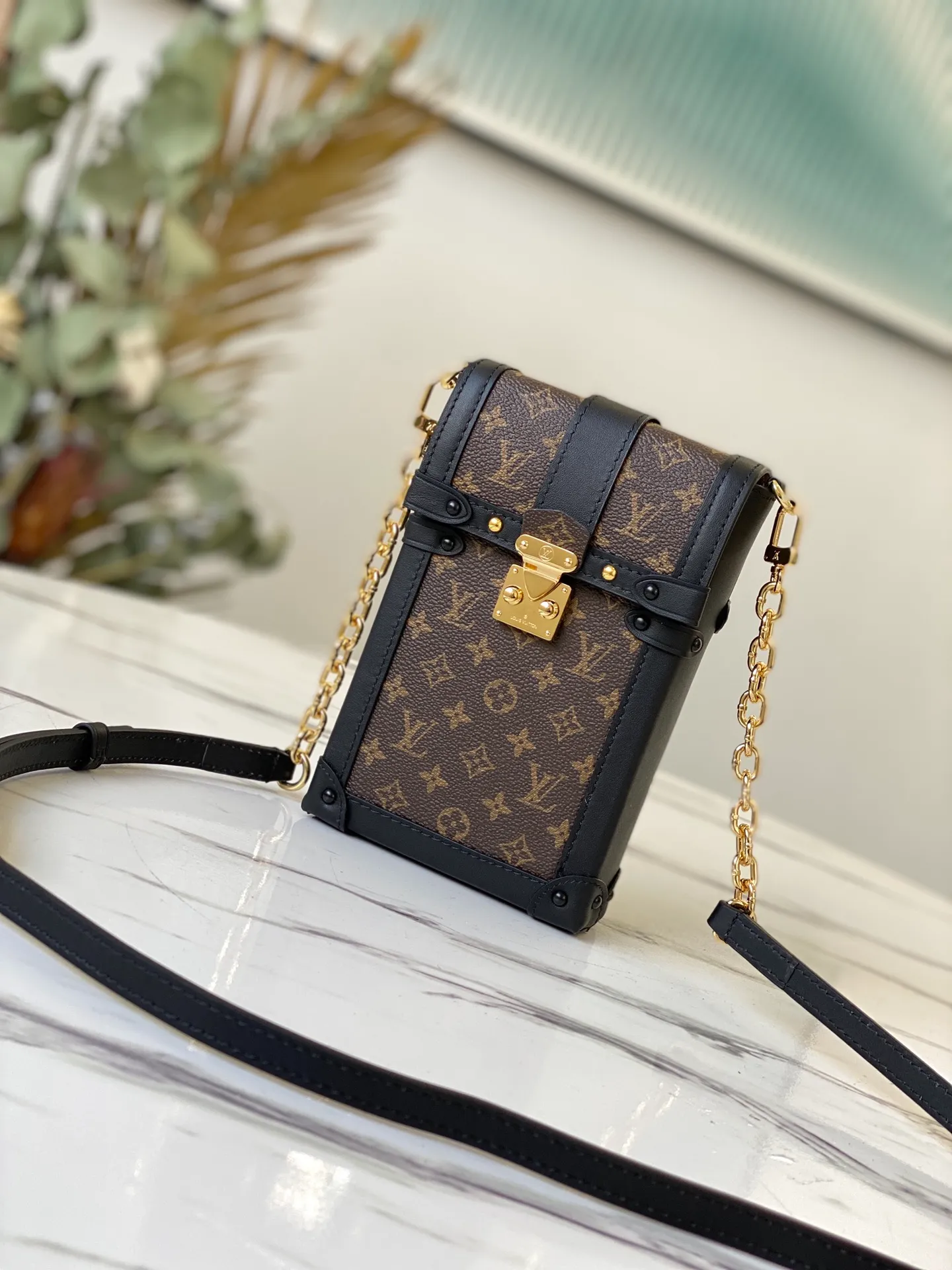 LOUIS VUITTON VERTICAL TRUNK POCHETTE BAG MONOGRAM COATED CANVAS BLACK M63913_1 LOUIS VUITTON VERTICAL TRUNK POCHETTE BAG MONOGRAM COATED CANVAS BLACK M63913 1