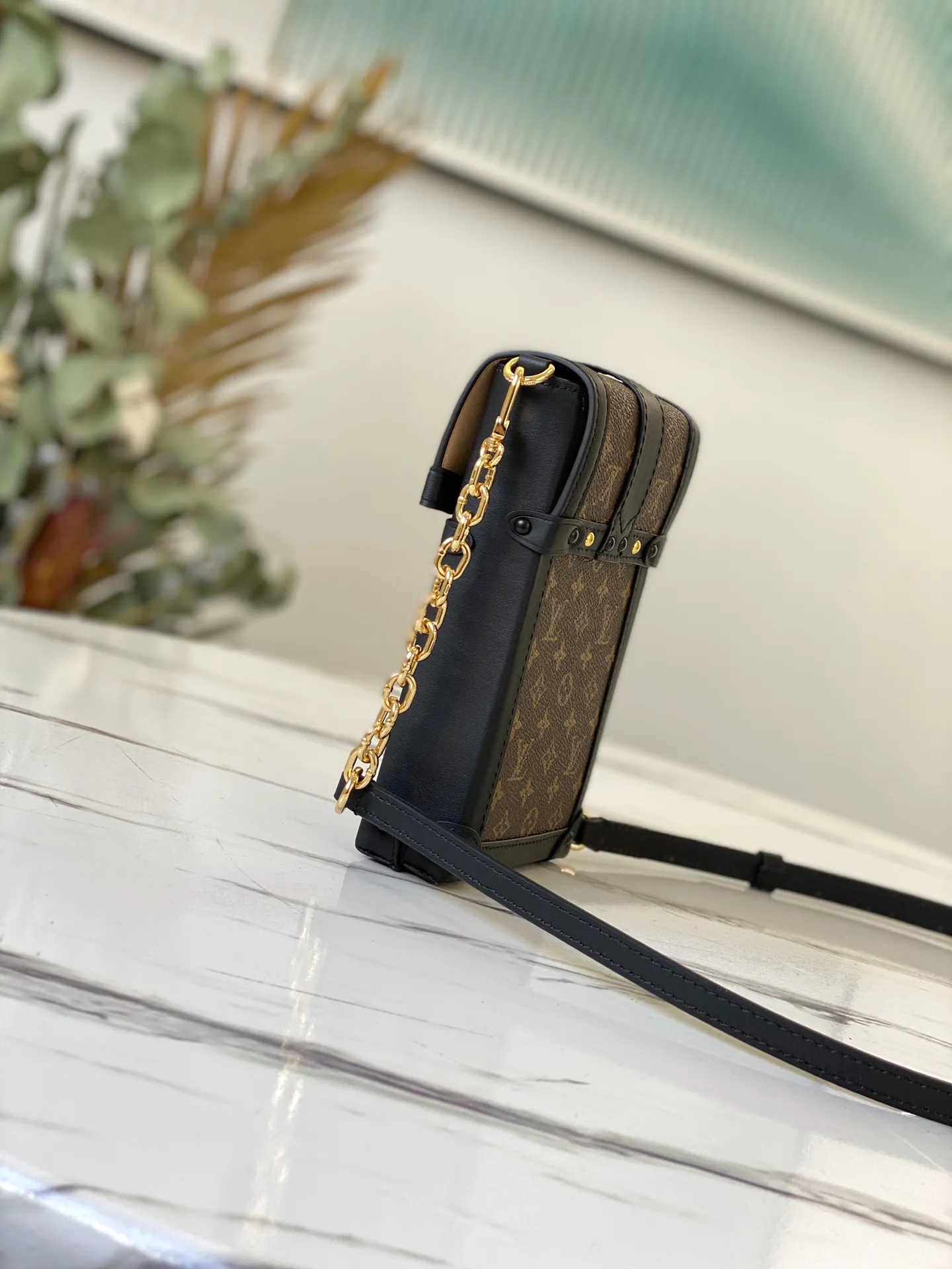 LOUIS VUITTON VERTICAL TRUNK POCHETTE BAG MONOGRAM COATED CANVAS BLACK M63913_2 LOUIS VUITTON VERTICAL TRUNK POCHETTE BAG MONOGRAM COATED CANVAS BLACK M63913 2