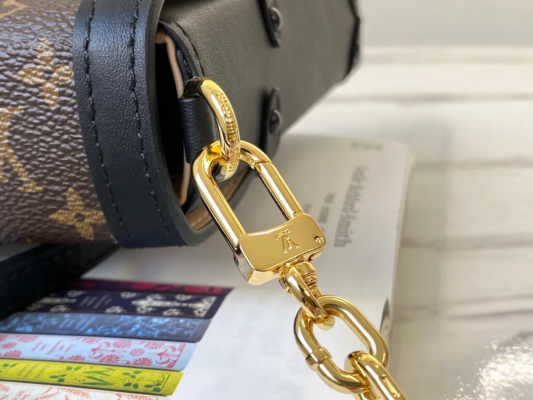 LOUIS VUITTON VERTICAL TRUNK POCHETTE BAG MONOGRAM COATED CANVAS BLACK M63913_7 LOUIS VUITTON VERTICAL TRUNK POCHETTE BAG MONOGRAM COATED CANVAS BLACK M63913 7